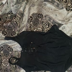 Black one piece swimsuit with gold hardware